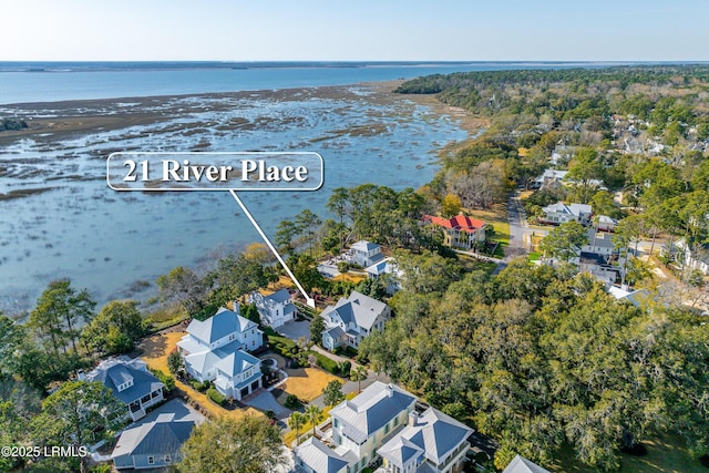 birds eye view of property featuring a residential view and a water view