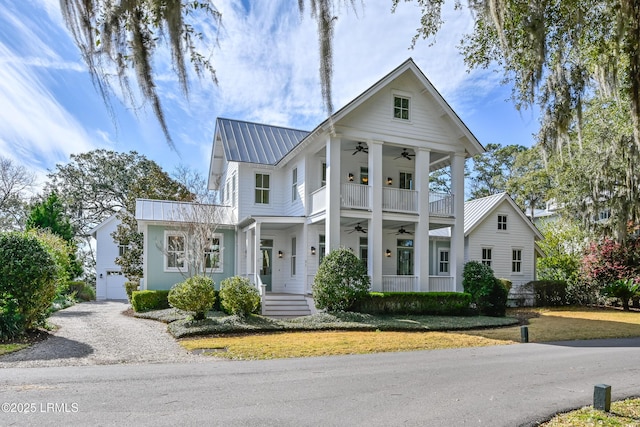 neoclassical / greek revival house with metal roof, a balcony, and a ceiling fan