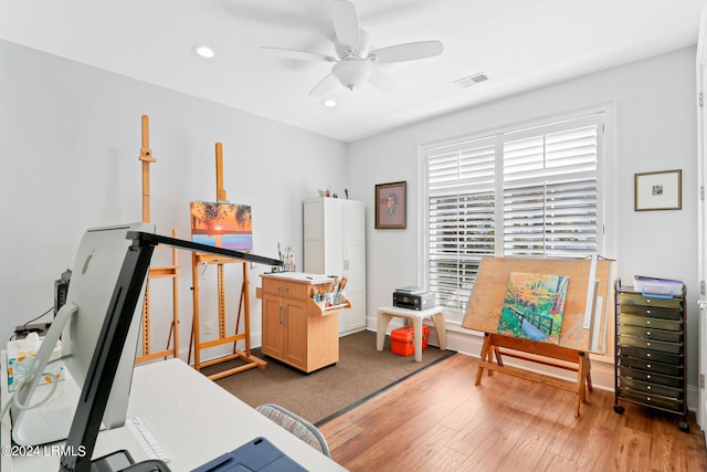 office area with ceiling fan and light hardwood / wood-style floors