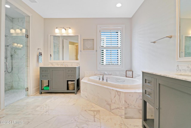 bathroom with vanity and plus walk in shower