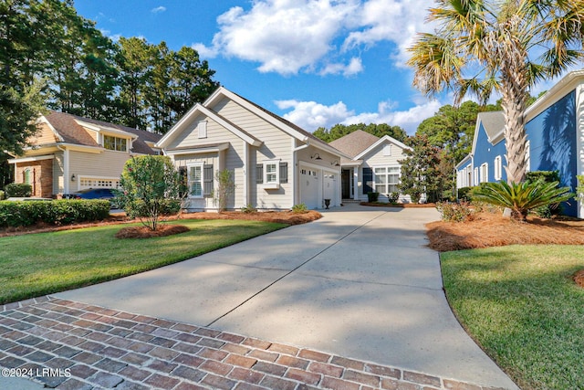 view of front facade with a garage and a front yard