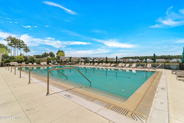 view of swimming pool featuring a patio area