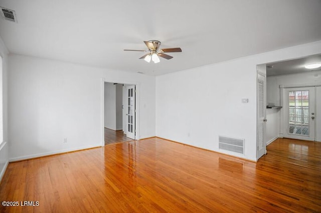 unfurnished room with hardwood / wood-style flooring and ceiling fan