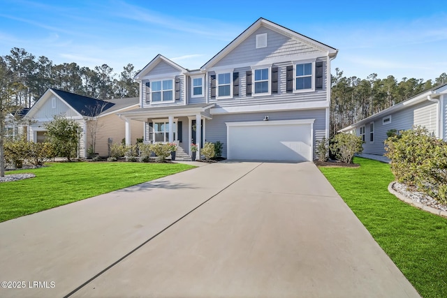 traditional home with a garage, driveway, and a front lawn