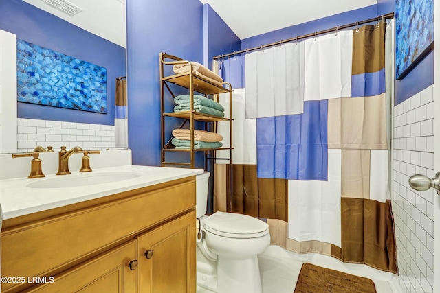 bathroom with toilet, vanity, visible vents, and a shower with shower curtain