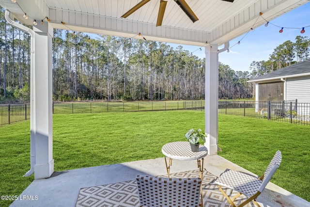 view of patio / terrace with a fenced backyard and a ceiling fan