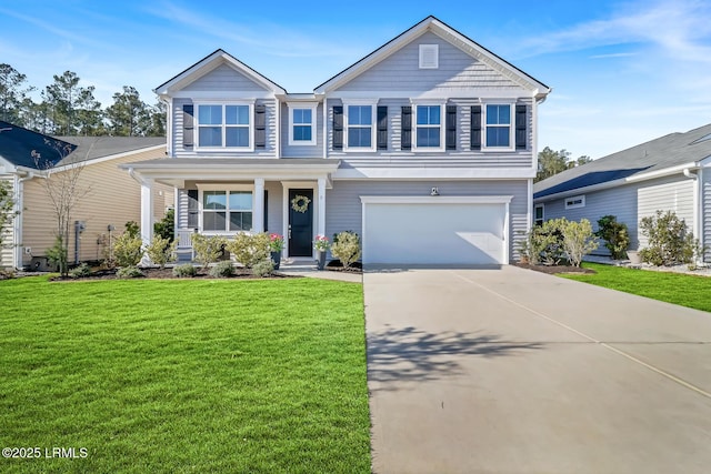 view of front facade with concrete driveway, a front lawn, and an attached garage