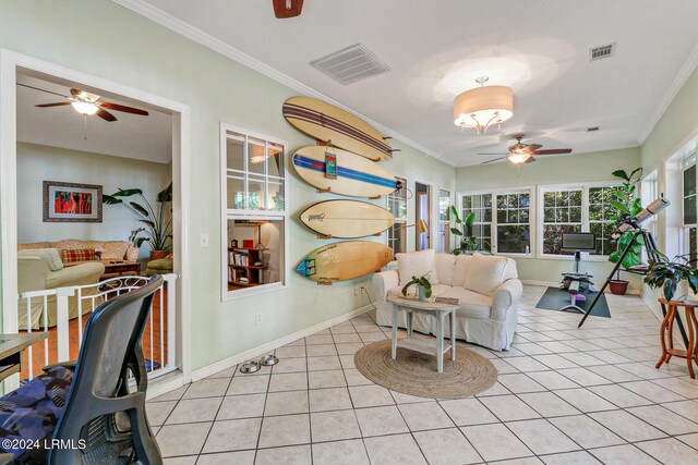 living room featuring crown molding, ceiling fan, and light tile patterned floors