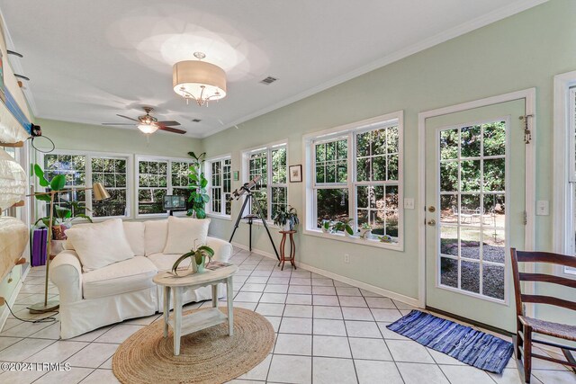 sunroom featuring ceiling fan