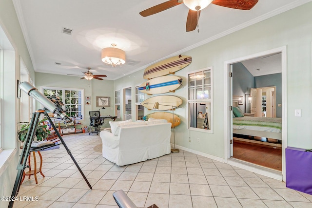 living room with crown molding, ceiling fan, and light tile patterned floors