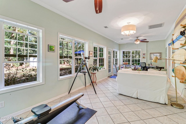 sunroom with ceiling fan