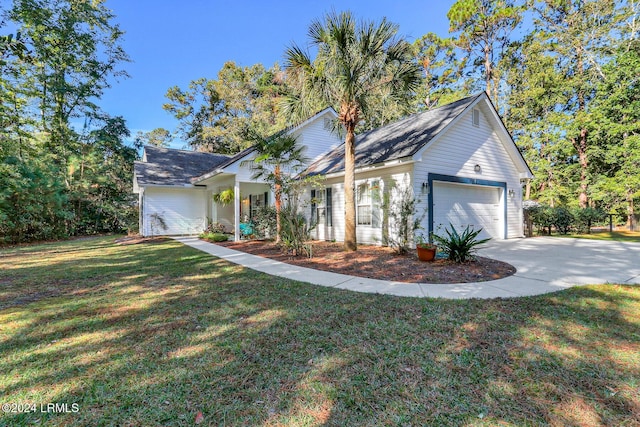 view of front of house with a garage and a front yard