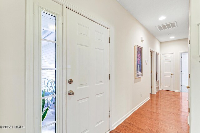 foyer entrance with light hardwood / wood-style flooring