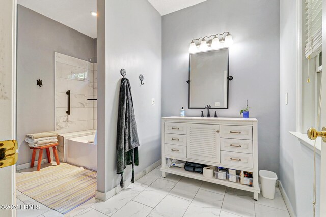 bathroom with vanity and separate shower and tub