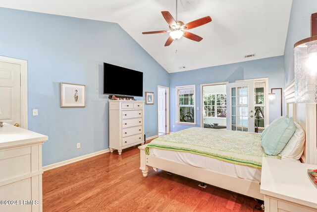 bedroom featuring lofted ceiling, light wood-type flooring, and ceiling fan