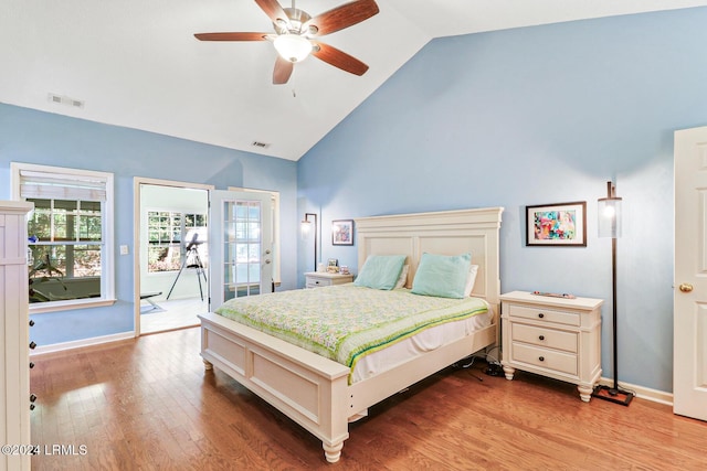 bedroom with hardwood / wood-style flooring, vaulted ceiling, ceiling fan, and access to outside