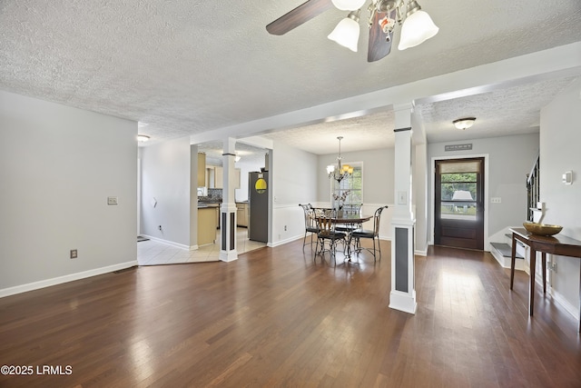 18 Lake View Ct, Bluffton, SC 29910 - dining room with ornate columns, a textured ceiling, wood finished floors, a ceiling fan, and baseboards