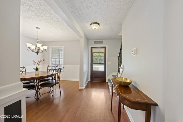 18 Lake View Ct, Bluffton, SC 29910 - entrance foyer with wood finished floors, a textured ceiling, a chandelier, and baseboards
