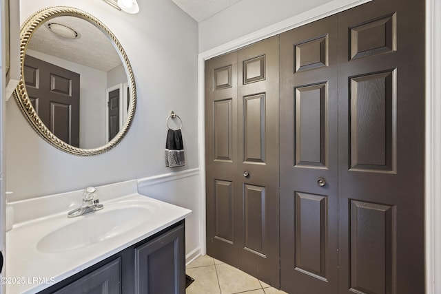 18 Lake View Ct, Bluffton, SC 29910 - bathroom with tile patterned flooring, vanity, and a textured ceiling