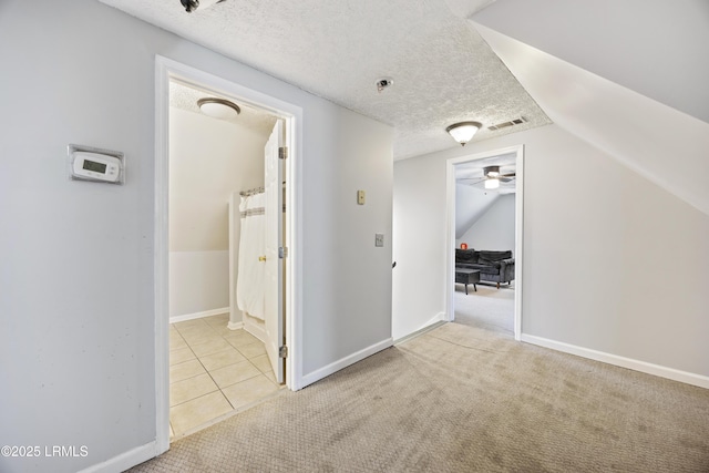 18 Lake View Ct, Bluffton, SC 29910 - bonus room with carpet, vaulted ceiling, a textured ceiling, tile patterned floors, and baseboards