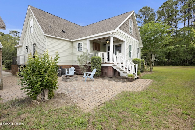 18 Lake View Ct, Bluffton, SC 29910 - back of house with an outdoor fire pit, a yard, a shingled roof, a patio area, and ceiling fan