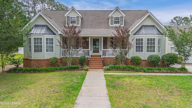 18 Lake View Ct, Bluffton, SC 29910 - view of front of home with a porch, a front yard, and roof with shingles