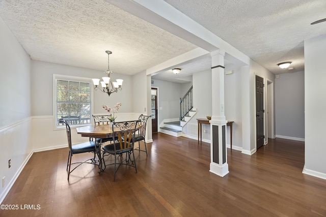 18 Lake View Ct, Bluffton, SC 29910 - dining area featuring a textured ceiling, wood finished floors, stairway, a chandelier, and decorative columns