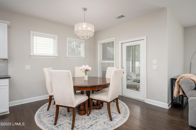 145 Rudder Run, Bluffton, SC 29910 - dining area with a chandelier, baseboards, and dark wood-style flooring