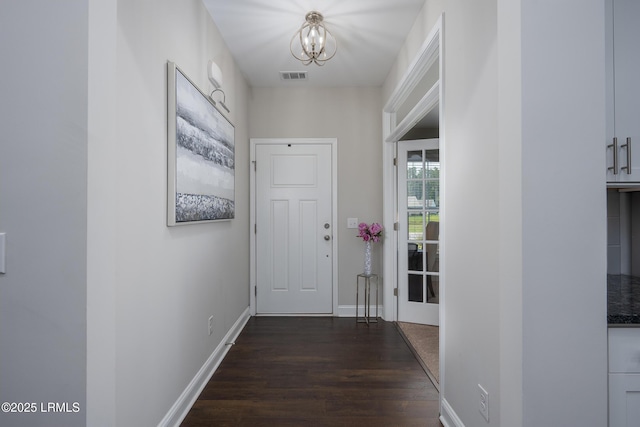 145 Rudder Run, Bluffton, SC 29910 - hall with dark wood-type flooring, a chandelier, and baseboards