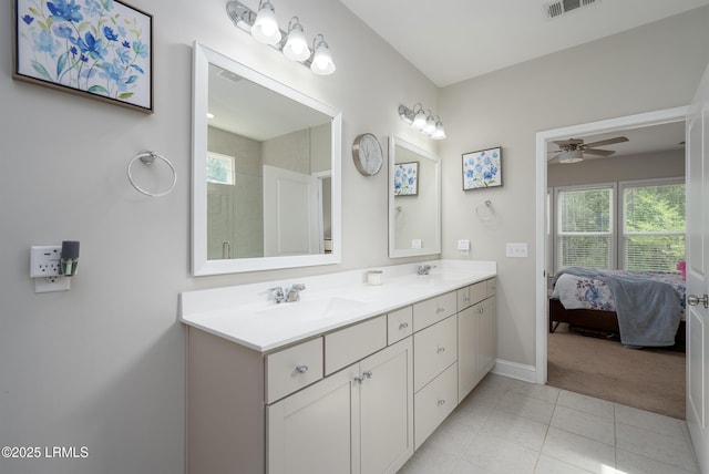 145 Rudder Run, Bluffton, SC 29910 - full bath featuring double vanity, ceiling fan, tile patterned flooring, baseboards, and ensuite bath