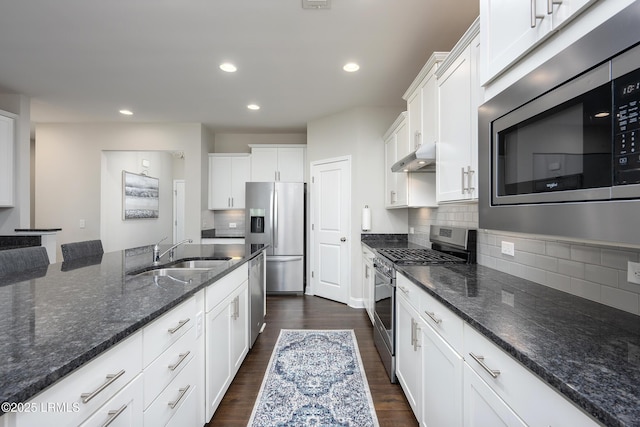 145 Rudder Run, Bluffton, SC 29910 - kitchen featuring appliances with stainless steel finishes, a sink, white cabinets, dark wood-type flooring, and dark stone counters