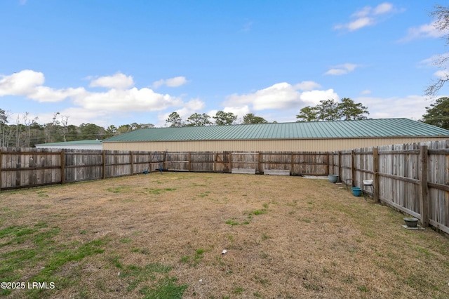 view of yard with a fenced backyard