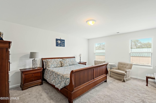 bedroom with baseboards and carpet flooring