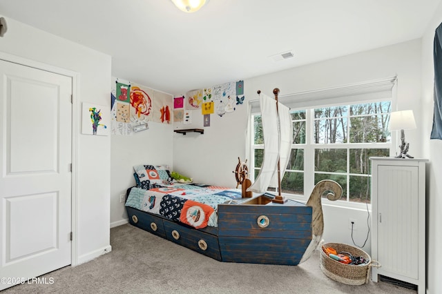 bedroom with carpet, visible vents, and baseboards