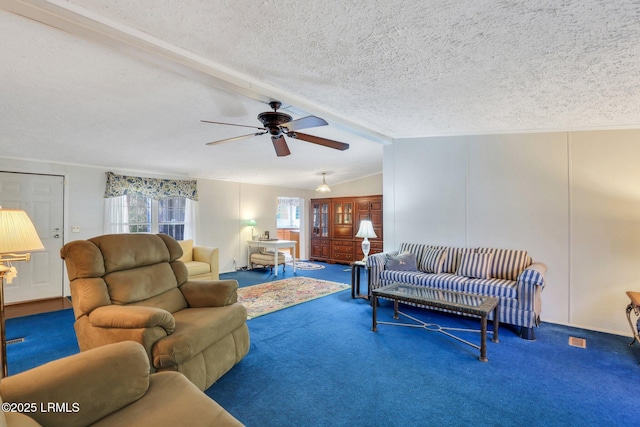 carpeted living area featuring lofted ceiling with beams, ceiling fan, and a textured ceiling