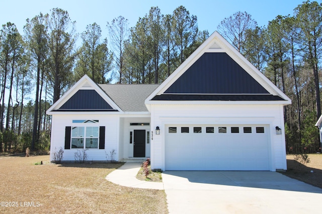 view of front of home featuring driveway, an attached garage, and board and batten siding