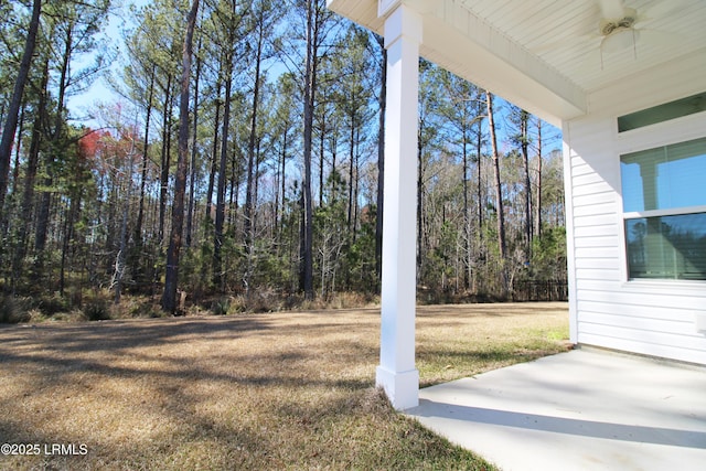 view of yard with a forest view