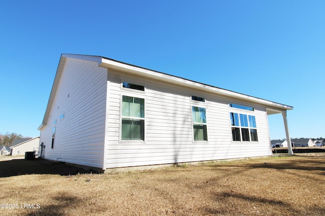 view of home's exterior featuring a yard