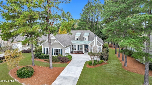 cape cod-style house with a front lawn