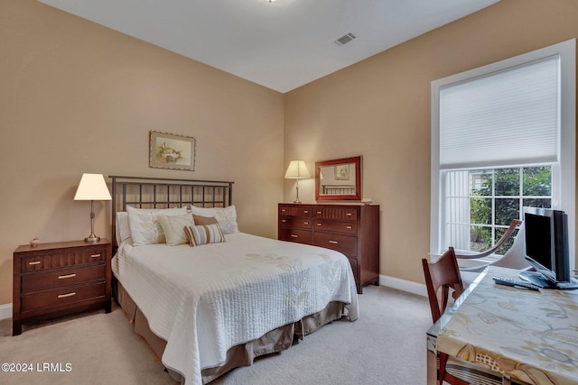 bedroom featuring light carpet