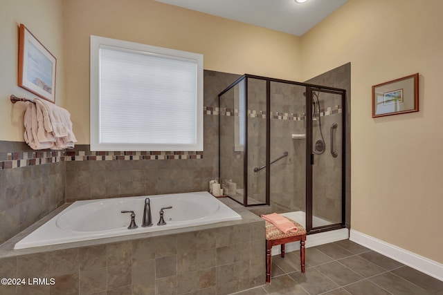 bathroom with tile patterned floors and separate shower and tub