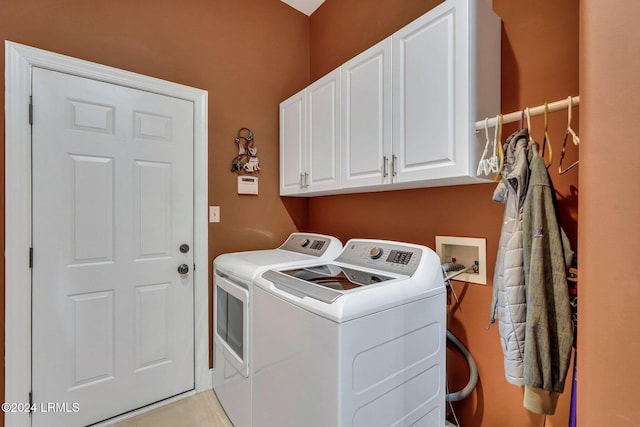 laundry area featuring cabinets and washing machine and clothes dryer