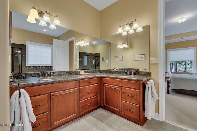 bathroom featuring vanity, tile patterned floors, and walk in shower