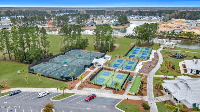 birds eye view of property with a water view