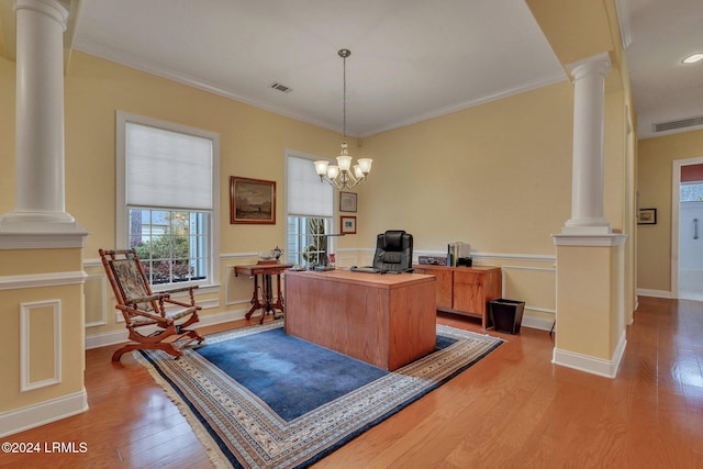 home office featuring ornamental molding, light hardwood / wood-style floors, and ornate columns