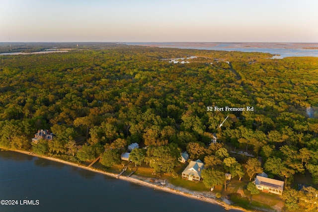 aerial view at dusk with a water view