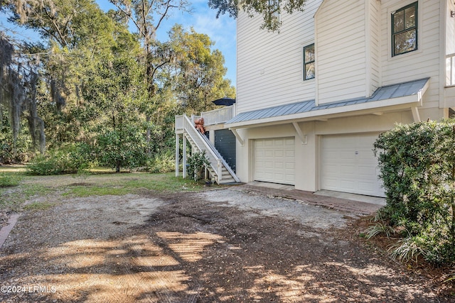 view of property exterior with a garage