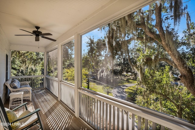 sunroom featuring a wealth of natural light and ceiling fan