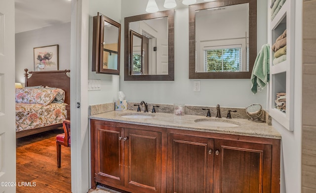 bathroom featuring vanity and hardwood / wood-style floors