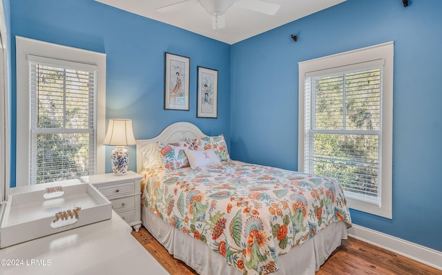 bedroom featuring hardwood / wood-style flooring and ceiling fan